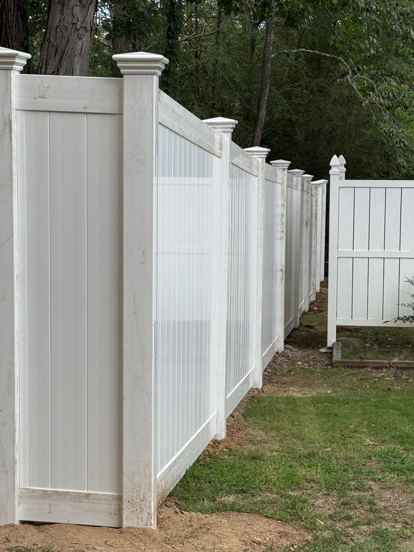 Long white vinyl privacy run with New England post caps